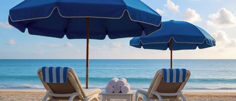 On the beach, sun-loungers, beach towels