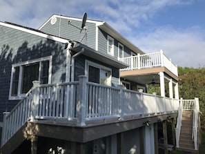 A two-story house with a balcony, white railings, and a satellite dish. - Montauk Beach House Walking Dist to Private Beach&Montauk Harbor Restaurants (Montauk)