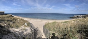 A beach with a sandy path leading to the water, surrounded by grass and a small building. - Montauk Beach House Walking Dist to Private Beach&Montauk Harbor Restaurants (Montauk)