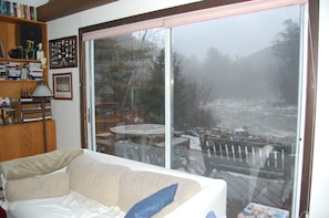 From the living room you can see the river and the deck