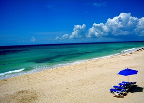 On the beach, sun loungers, beach towels