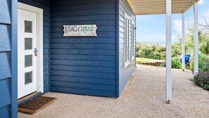 A house with a sign reading "Beach House" on the exterior wall. - Flinders View Beach House (4Bed 2Bath) - Flinders View Beach House - Executive Holiday Home (Augusta)