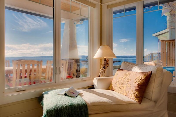 White slipcovered chaise lounge with a good book.