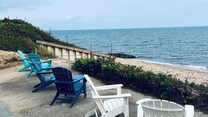 Outdoor seating with a view of the ocean.
