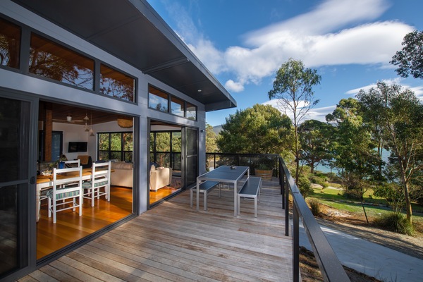 Spacious house with opening doors to wrap around decks and beach and bay vistas