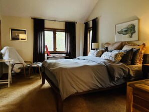 A bedroom with a bed, a desk, a chair, and a window with curtains. - Modern-Rustic Style, Spacious, Suntec Townhouse. Hot tub & sauna. (Dover)