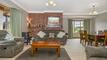 Flat-screen TV, DVD player, books, video library