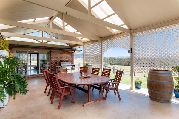 Entertainment area with Pergola, and enclosed dog proof spacious yard.