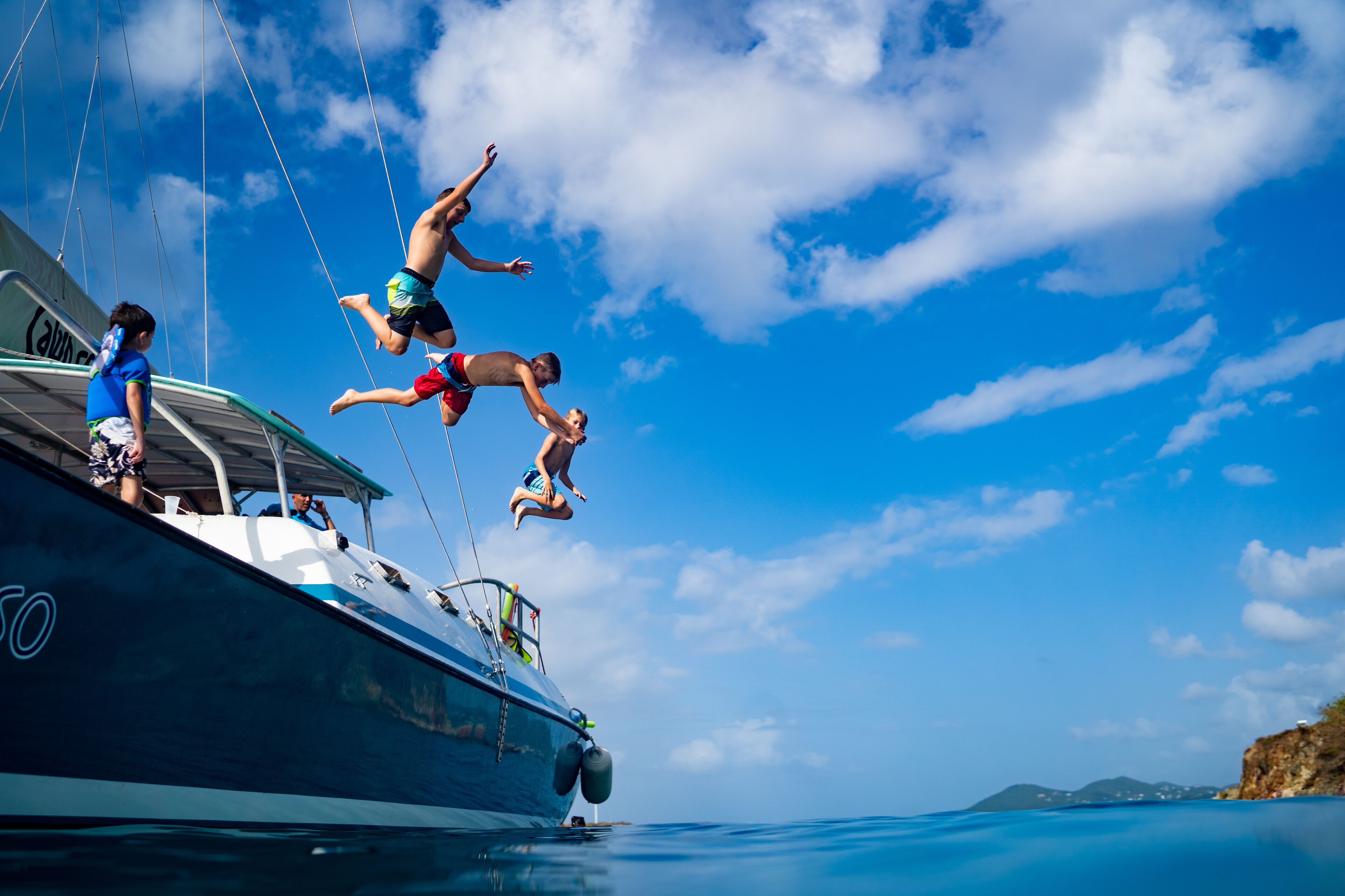 A boat with a clear sky and calm sea.
