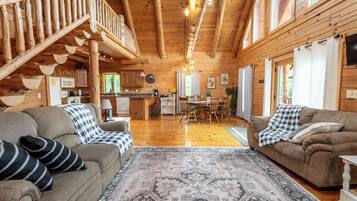 Télévision, cheminée, lecteur de DVD, baby-foot