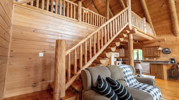 Télévision, cheminée, lecteur de DVD, baby-foot