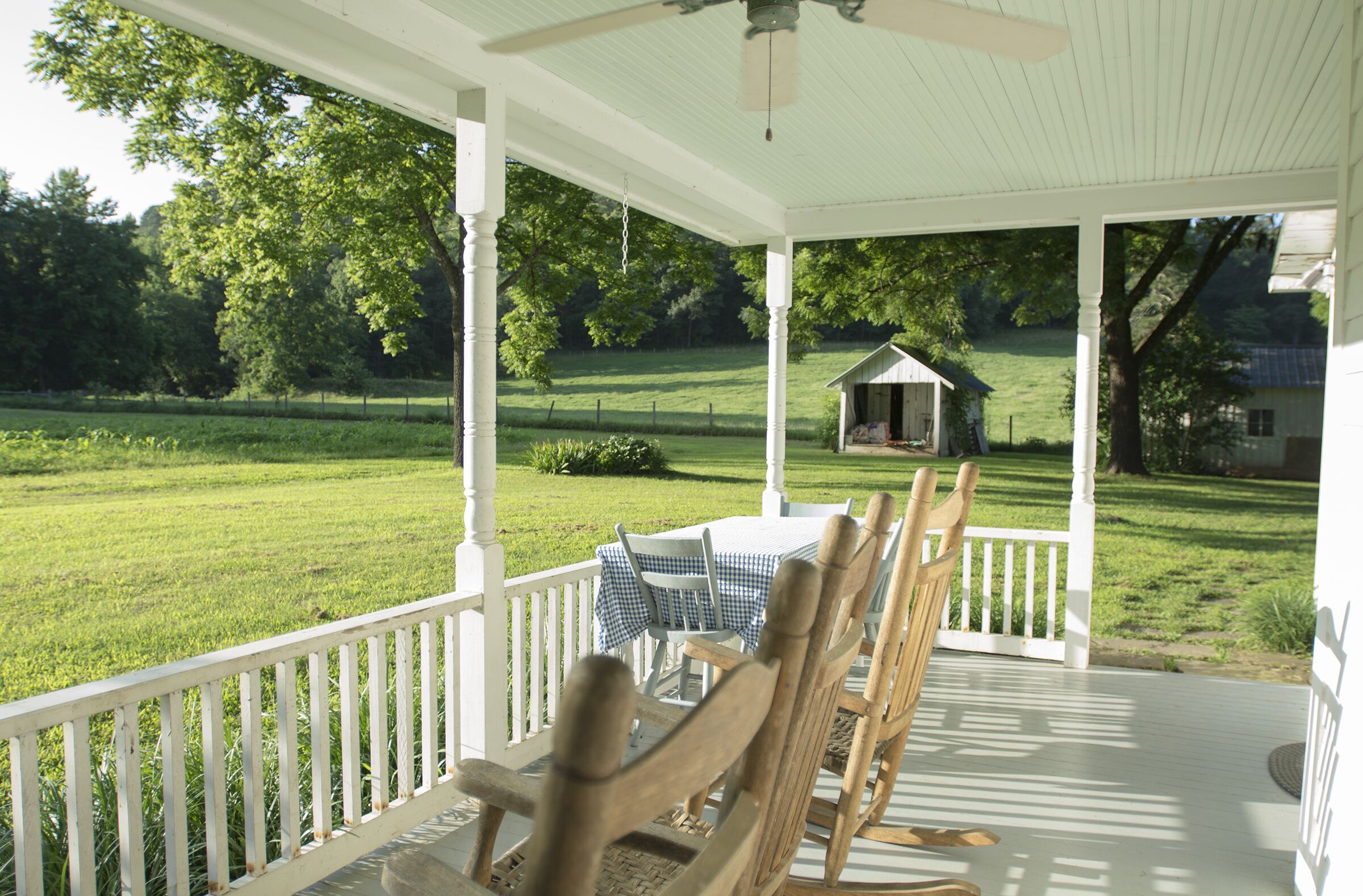 The back porch looks out to the garden and pastures