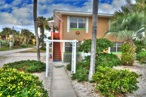 Stunning two-story residence with a charming entrance and beautifully manicured grounds.
