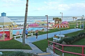 Relax by the pool or stroll to the beach, where lounge chairs and umbrellas offer shade.