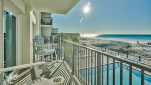 A balcony with a view of the beach and ocean. - Gulf Front Sea Oats 303 with Rocker Recliner, Comfy beds and Beach Service!  (Fort Walton Beach)