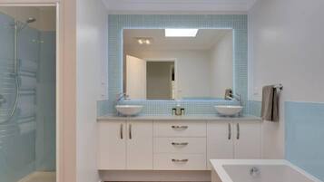 Bathtub, hair dryer, towels, soap