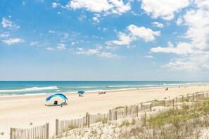 A beach with a clear sky, a sandy shore, and a wooden fence. - Ruff Life - Classic Island Cottage - 4 BR and Easy Beach Access. Dog Friendly! (Surf City)