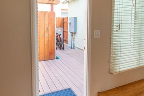 Enjoy the serene view from your room's deck, where bicycles are parked and a bench invites relaxation.