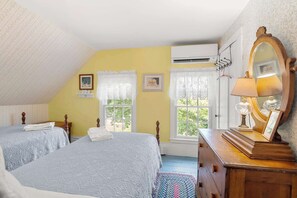 A bedroom with two beds, a dresser, a mirror, and a window with lace curtains. - On the Chatham Loop - 1 Min to the Beach! (Chatham)