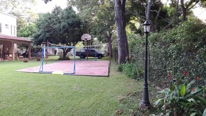 A house with a swimming pool, a hammock, and a basketball court. - Panama Santa Clara Beach Residence (Cocle)