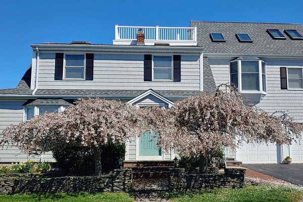 Front with main house on left, in law apt on right above garage with roof-deck