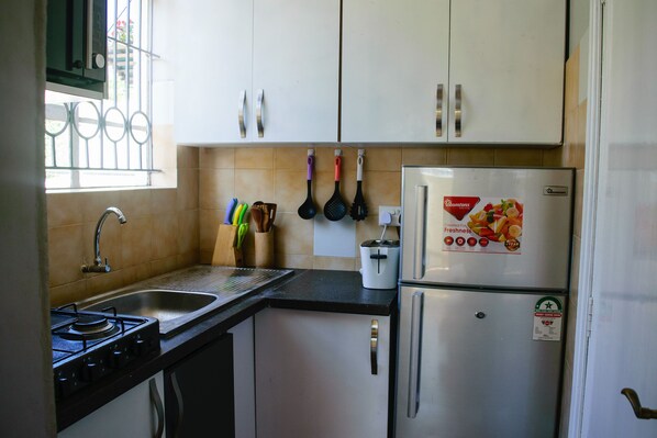 Microwave, oven, coffee/tea maker, cookware/dishes/utensils