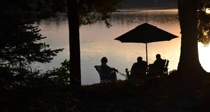 The Wee White Cottage on Tripp Lake in Poland, Maine.