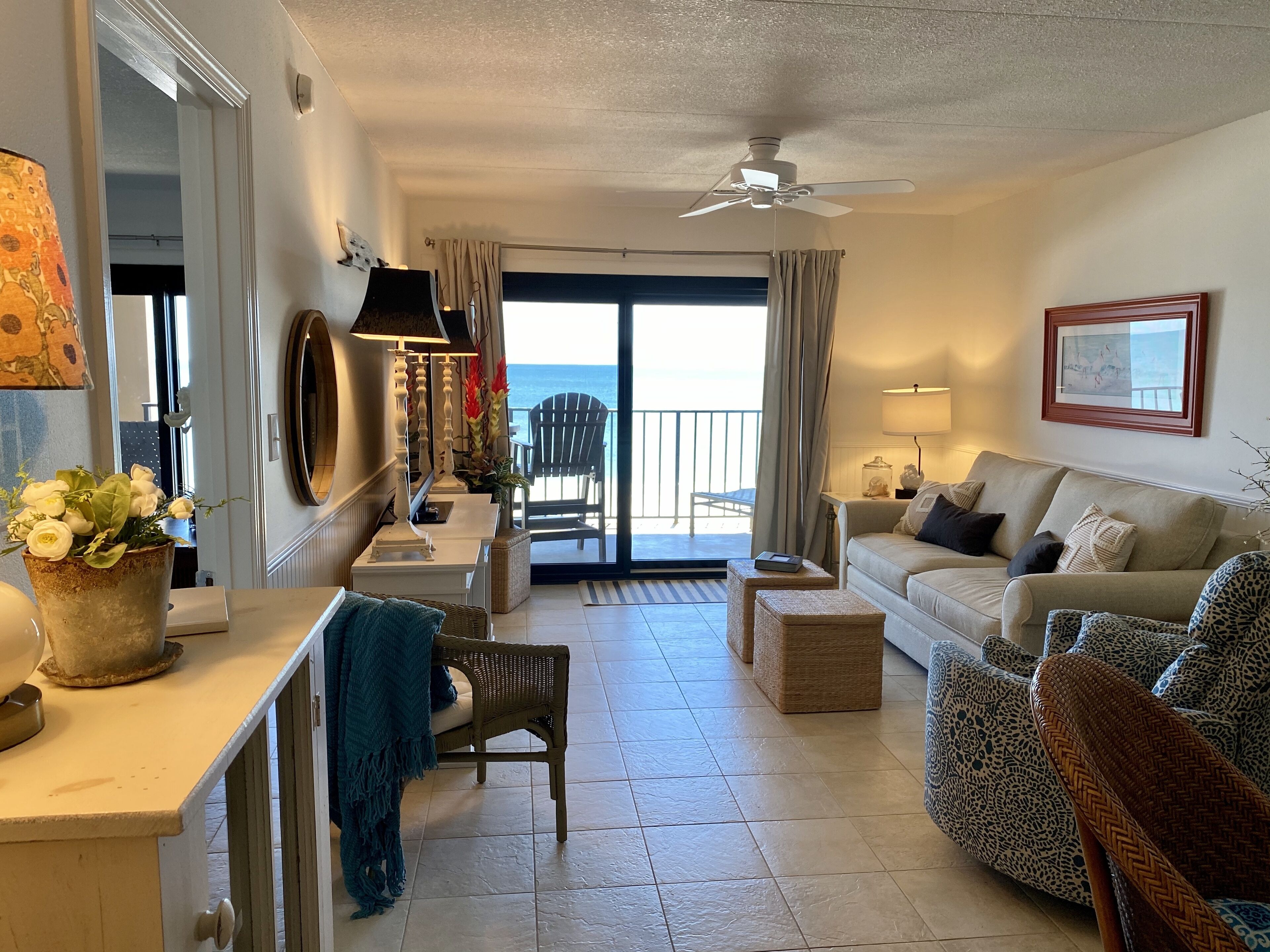 Living area looking out to the beach.  Master bedroom in doorway on left.