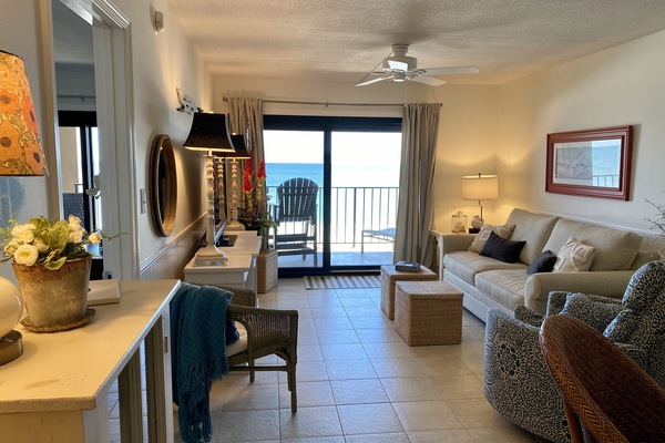 Living area looking out to the beach. Master bedroom in doorway on left.