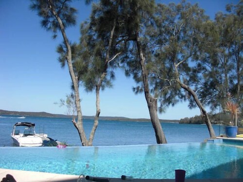 Luxury Waterfront Home with pool and spa family and pet friendly.