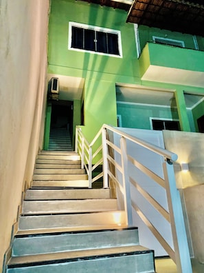 Staircase leads to a landing with a window above.