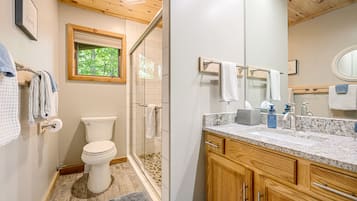 Combined shower/tub, hair dryer, towels, soap