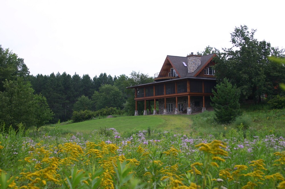 Premium log home on 600+ private wooded acres with private lake and waterfront