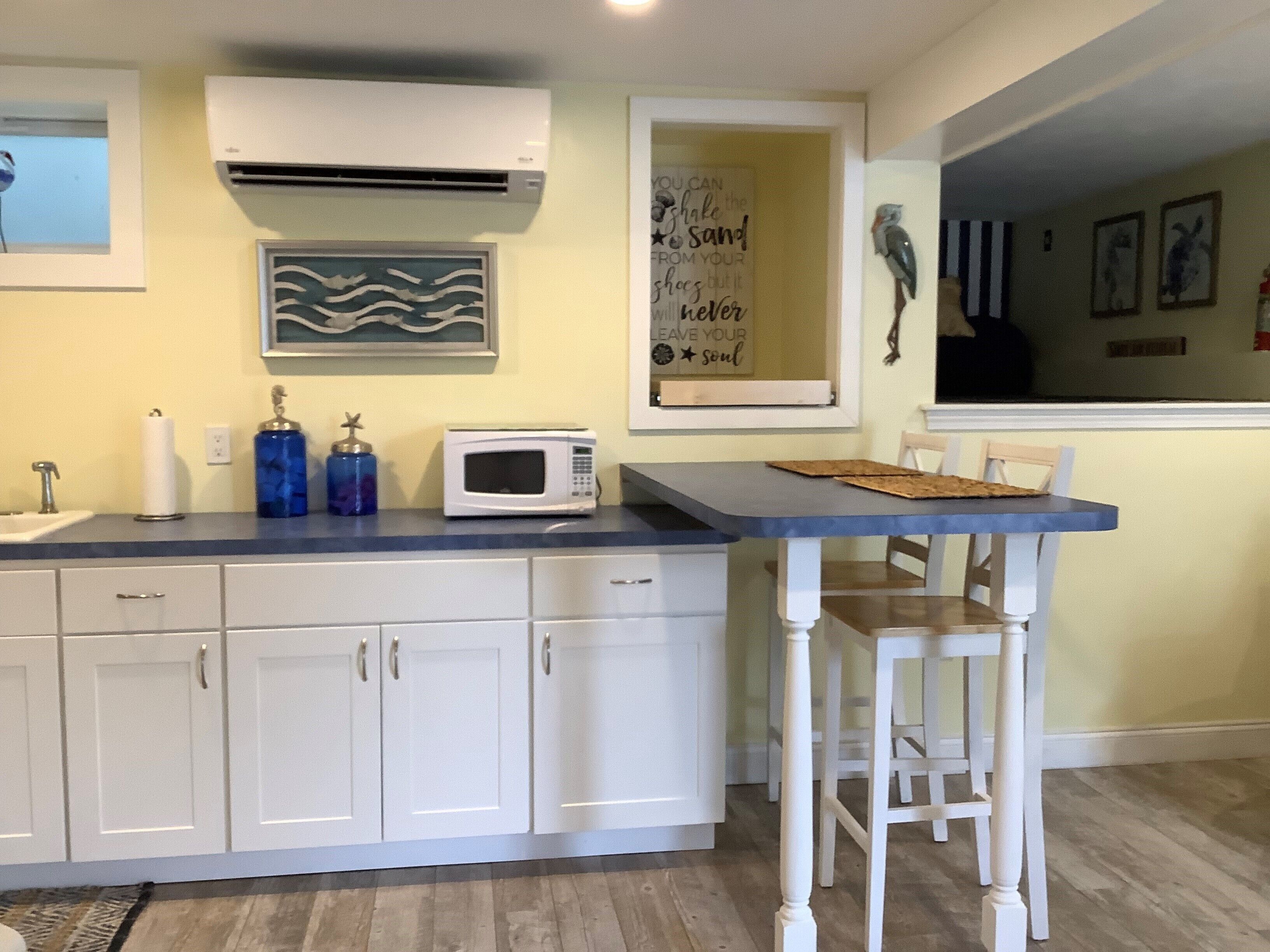 Coastal/modern condo, walking distance to beautiful sandy beach.