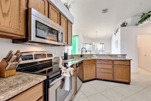 Fridge, microwave, oven, stovetop - Secluded Luxury Pool Home, Close to Disney w/ Oversized pool Special offers now (Kissimmee)