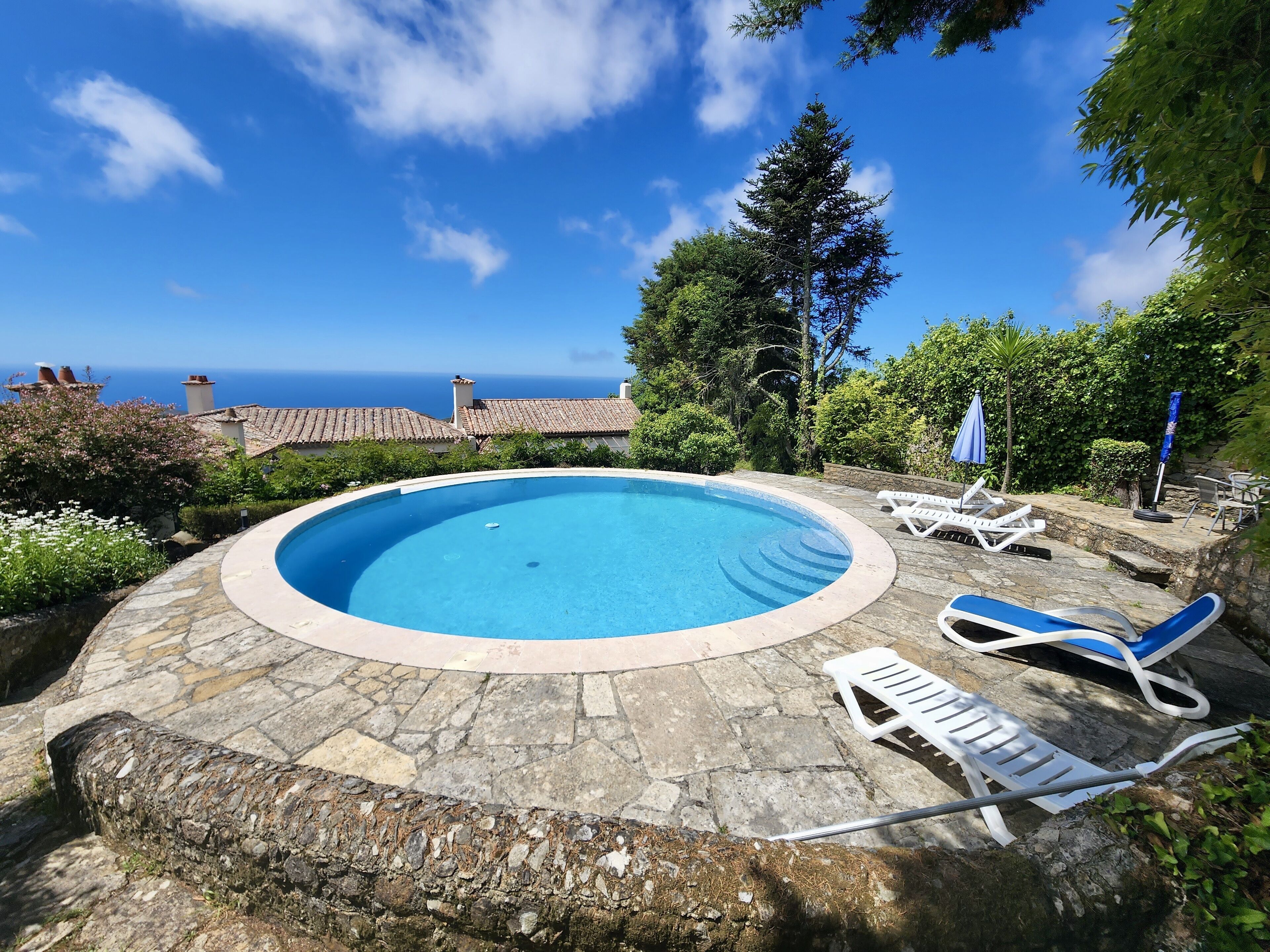 Pool  house and sea (Cottage roof is on the right)