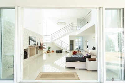 Contemporary style house with 4 suites and 6 bathrooms in gated community