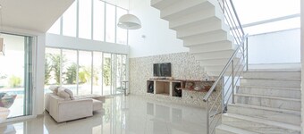 Contemporary style house with 4 suites and 6 bathrooms in gated community