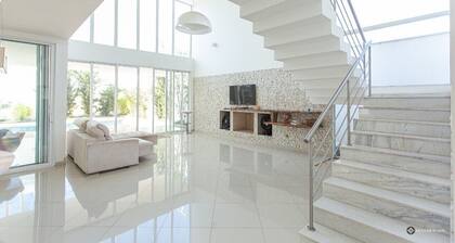 Contemporary style house with 4 suites and 6 bathrooms in gated community