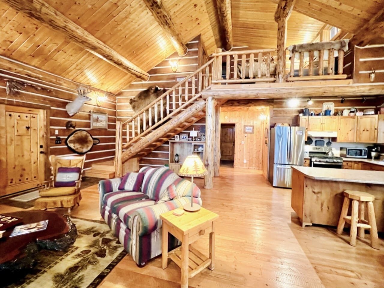 Great Room - living area, dining area and kitchen with gas stove, tv and vaulted ceilings