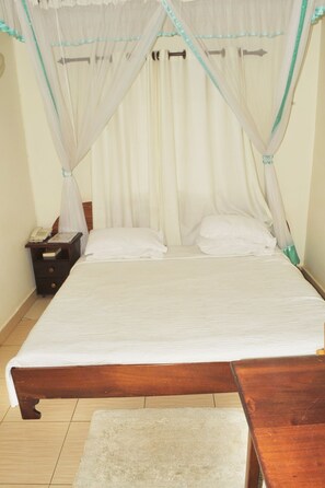 Deluxe Single Room, 1 Bedroom, Private Bathroom | Down comforters, memory foam beds, desk, free WiFi - Scroll Inn Hotel (Kampala)