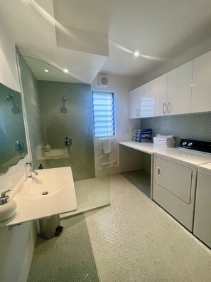 Shower, hair dryer, towels, soap