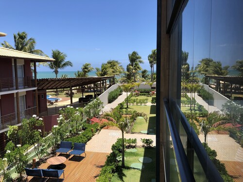 Beachfront village with natural pools near the condominium!