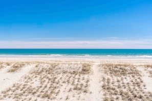 A beach with sand dunes and a clear blue sky. - Feels Like Home-3 BR Oceanfront Duplex; Covered Porches (Topsail Beach)