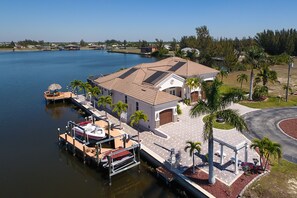 Exterior - Villa Laguna - Stunning Views! Elec & solar heated pool, spa on Gulf-access canal - SWFL Rentals (Cape Coral)