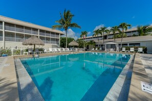 Outdoor pool, a heated pool - TROPICAL  2 BR/ 2 Ba, 77 Steps to BEACH  Unit #304/ 20% DISCOUNT / Dogs welcome! (Sanibel Island)