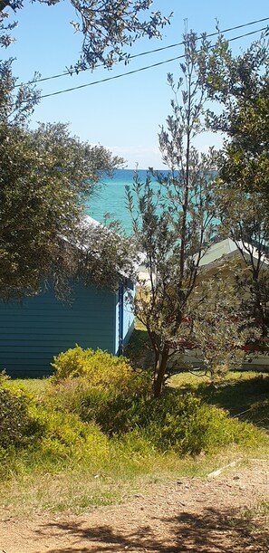 Enjoy a serene seaside retreat with a clear ocean view from this tranquil coastal home.