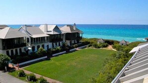 A large, modern building with multiple sections and a well-maintained lawn in front. - Charming Carriage House located in Rosemary Beach ~ Pet Friendly (Rosemary Beach)