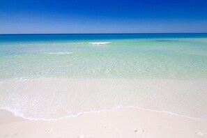 A beach with clear turquoise water and white sand. - Gulf Front Island Princess 201 with Beach Service, Soft Beds and Recliners! (Fort Walton Beach)