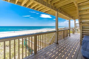 A wooden deck with a view of the beach and ocean. - Sundog - Spacious 4 BR Oceanfront Home with 2 Sun Decks (North Topsail Beach)